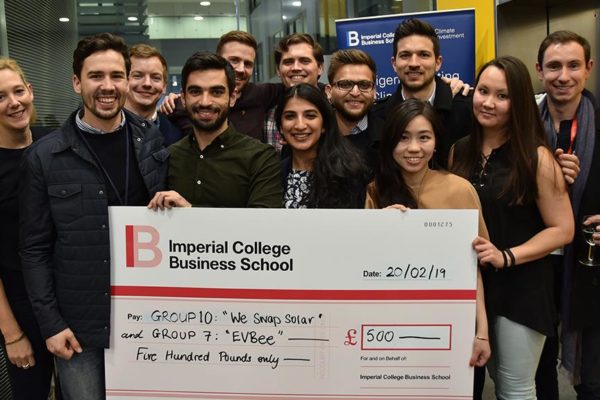 Winning group behind an Imperial College Business School competition winners' cheque